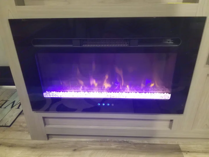 Enjoy the ambiance of this electric fireplace in your RV rental, with captivating purple flames and white crystals.. Coleman Lantern 17B 2023