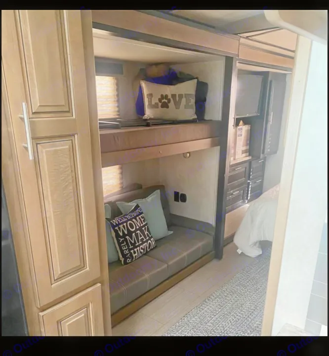 Explore this RV rental's spacious interior featuring cozy bunk beds, a comfy sofa, and a bedroom area.. FR3 FR3 Motorhome 2020