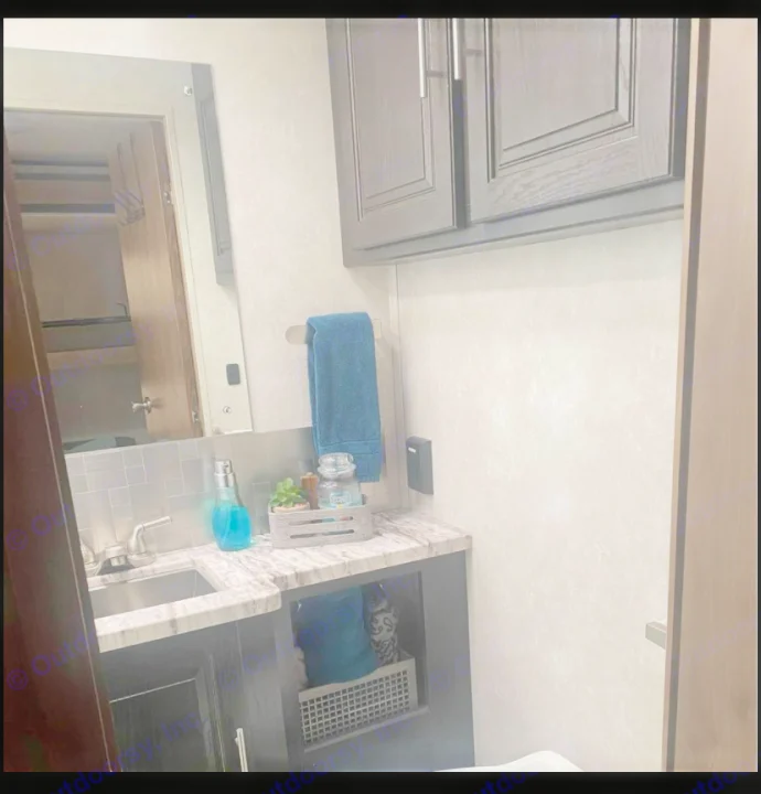RV rental bathroom: compact vanity, sink, cabinets, & mirror with organized decor.. FR3 FR3 Motorhome 2020