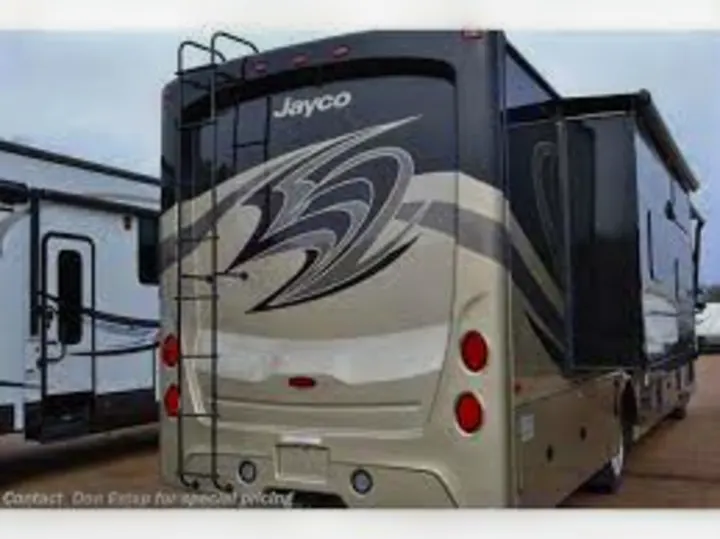 Spacious black and tan Jayco RV rental motorhome with extended slide-out, rear ladder, ready for travel adventures.. Jayco Precept Prestige 2021