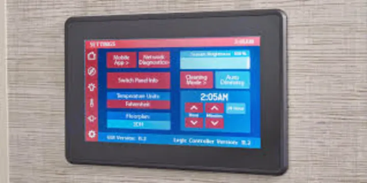 RV rental smart panel: a digital control touchscreen displaying settings like temperature units, brightness, and current time.. Jayco Precept Prestige 2021