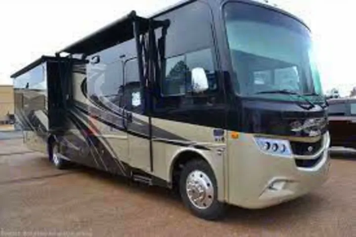 A sleek black and tan luxury motorhome with slide-outs extended, ready for travel. Find your perfect RV rental adventure!. Jayco Precept Prestige 2021