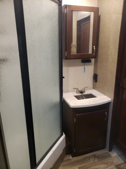 This RV rental's compact bathroom includes a shower, vanity with sink, and mirrored cabinet. Ready for your trip.. Jayco Octane 2019