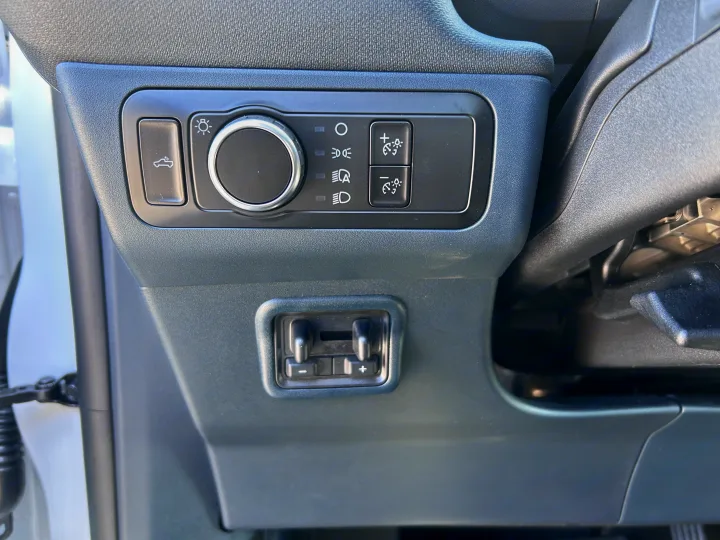 RV rental interior: dash with headlight dial, instrument dimmers, bed light, and trailer brake controller.. Ford Maverick 2024