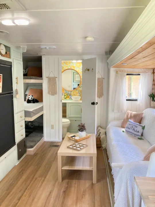 Modern RV rental interior with bright living space, bunk beds, and a cozy bathroom. Ideal for family adventures.. Other Other 2013