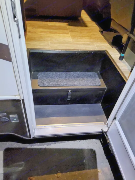 RV rental entryway with two steps: the top step features a grey mat, leading to a light wood-look floor inside.. Forest River Other 2018
