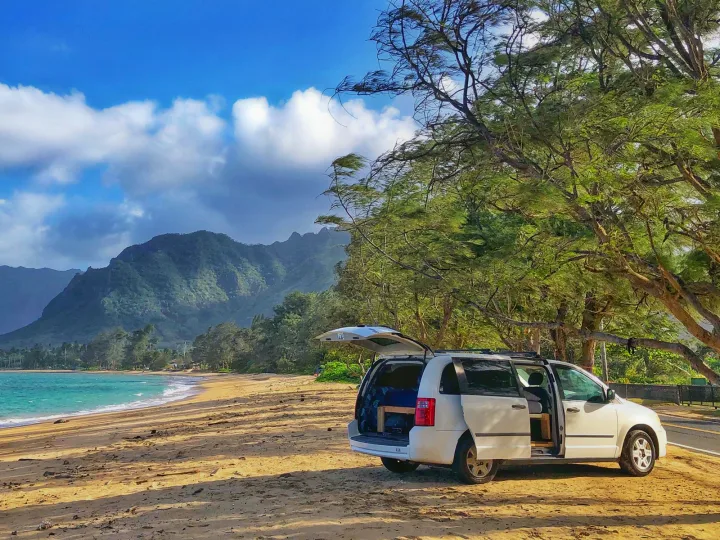 Enjoy beach camping! This RV rental (converted camper van) is perfectly set up by the ocean with stunning mountain views.. Dodge Grand Caravan 2010