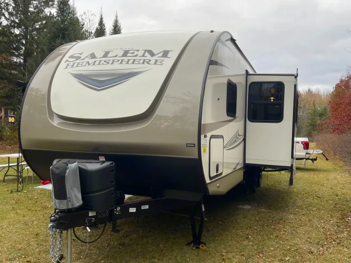 Modern Forest River Salem Hemisphere RV rental on grass, slide-out open. Perfect for camping and outdoor adventures.. Forest River Salem Hemisphere HL 2021