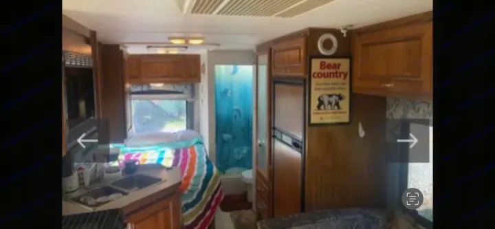 Kitchen, Queen Bed, bathroom, refrigerator, dining center… (L to R). Dutchmen Express 2013