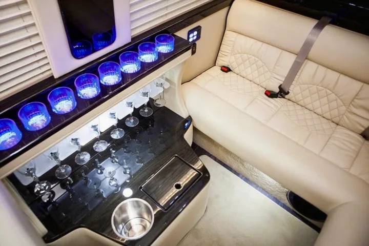 Experience luxury rv rental travel! Plush interior with illuminated bar, stemware, and comfortable seating perfect for your next adventure.. Ultimate Toys Ultimate Limo 2022