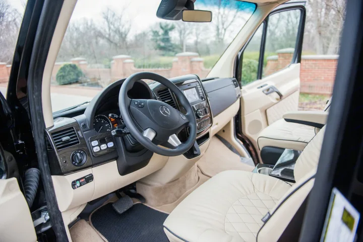 Luxurious Mercedes-Benz Sprinter van interior, ideal for rv rental, with cream leather seats and modern dashboard.. Ultimate Toys Ultimate Limo 2022
