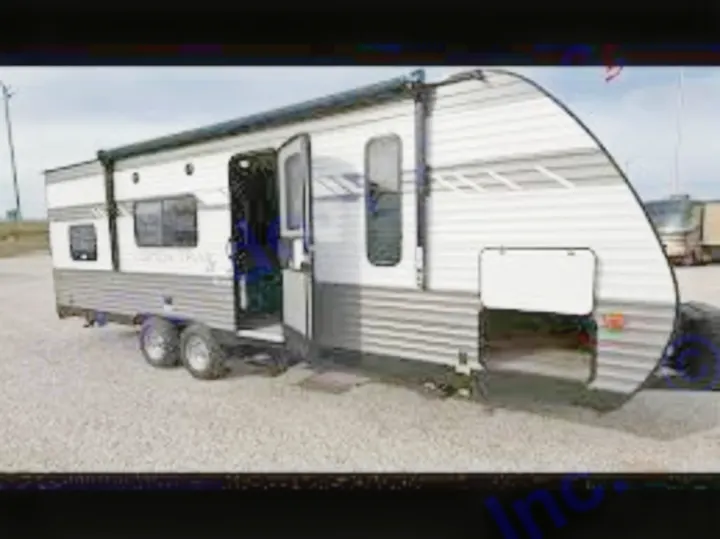 A white and grey travel trailer with an open door, great for RV rental, offers mobile lodging for journeys.. Dutchmen Aspen Light LE 2022