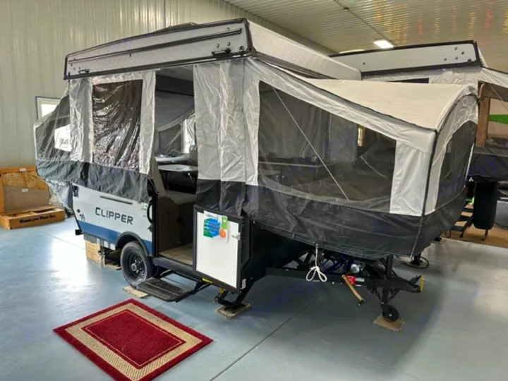 This fully extended pop-up camper, an ideal RV rental, features canvas walls, mesh windows, and an inviting entrance.. Coachmen Clipper 806XLS 2022