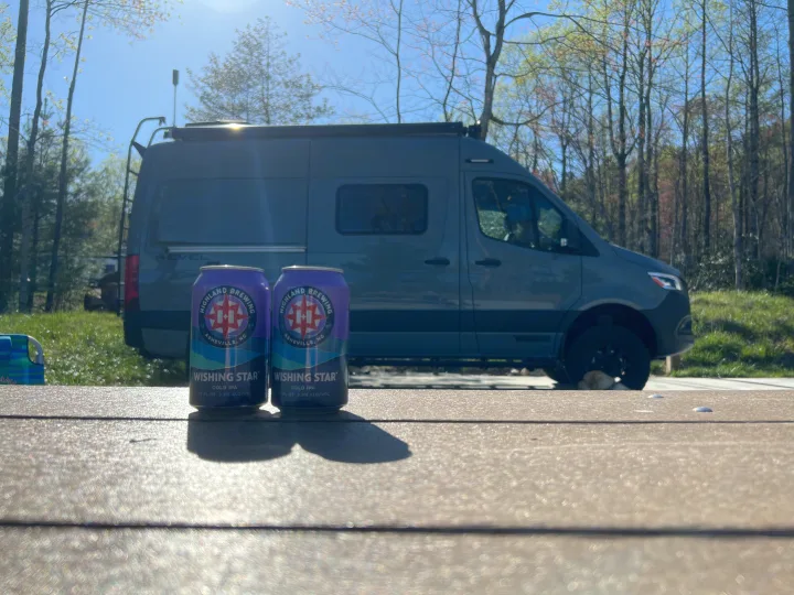 RV rental adventure with a Winnebago Revel van, enjoying Highland Brewing's Wishing Star IPA on a sunny day.. Winnebago Revel 2023
