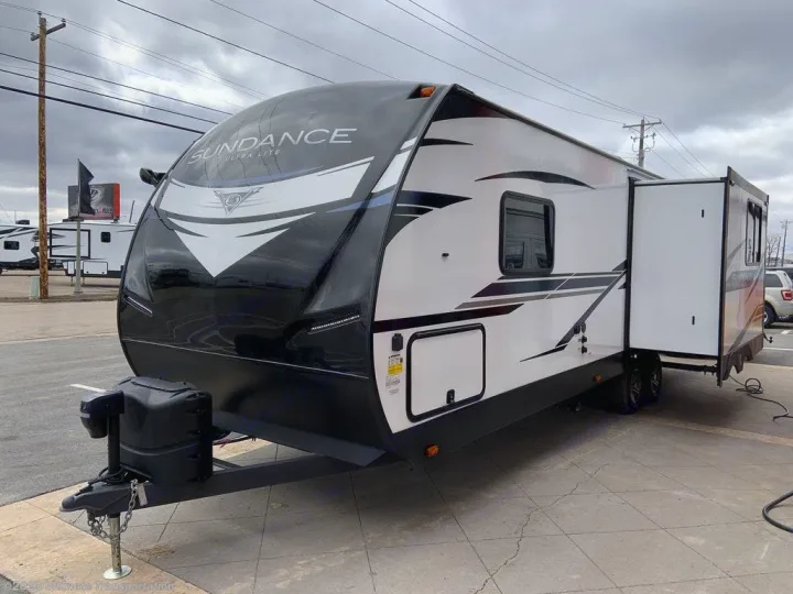 Experience comfort with this Sundance Ultra Lite travel trailer RV rental. Features a sleek design & extended slide-out.. Heartland RVs Sundance Ultra Lite 2022