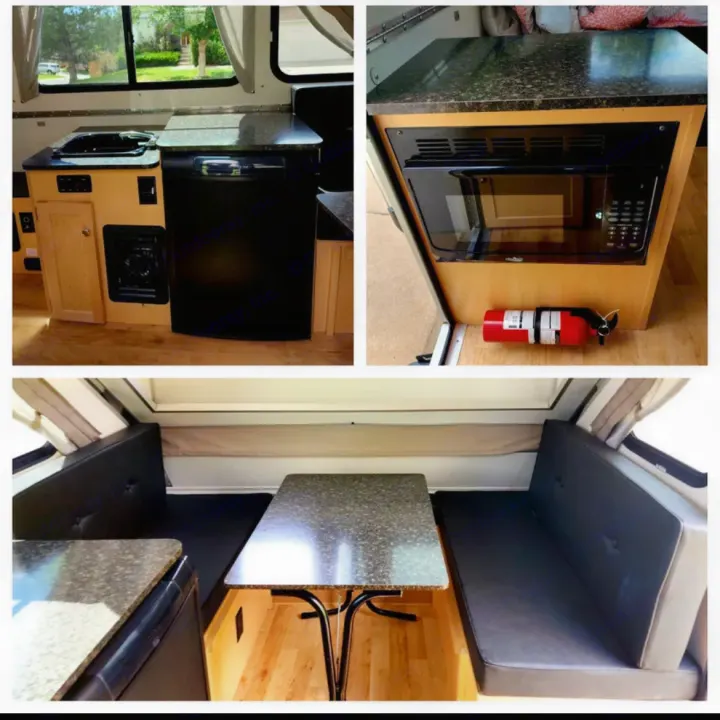 This pop-up camper RV rental interior features a compact kitchen with sink, microwave, and fridge, plus a dining area that converts to a bed.. A-liner Classic 2022