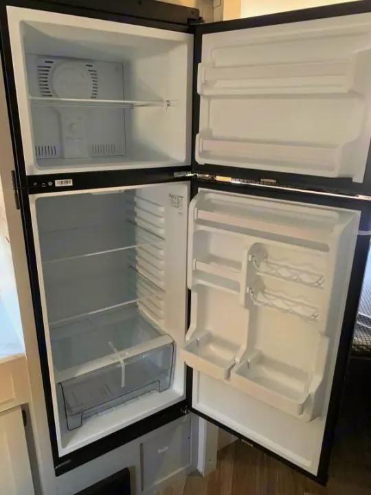 Clean, empty rv rental refrigerator & freezer. Top freezer, bottom fridge with crisper, door shelves, ready for use.. Forest River Salem FSX 178bhsk 2023