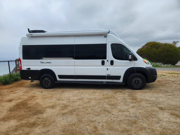 White Thor Tellaro RV rental. This modern camper van with black wheels is ready for your next road trip adventure.. Thor Tellaro 2023