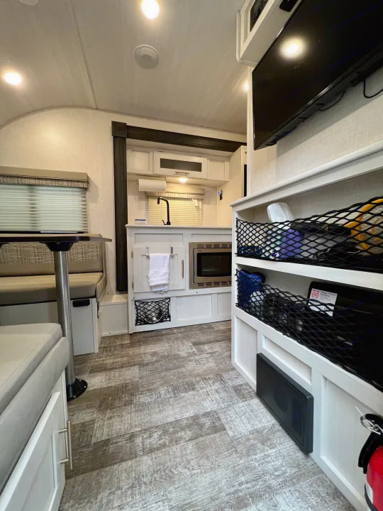Step inside this RV rental: a bright interior with a kitchenette, dinette, and smart storage for comfortable travel.. Forest River R-Pod RP-190 2021