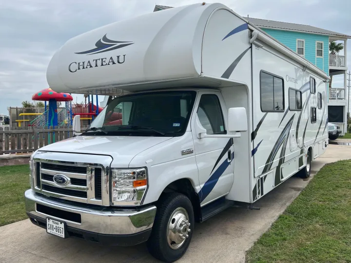 Explore in this Class C Chateau RV rental, parked at a fun RV park with a vibrant playground.. Thor Chateau 2020