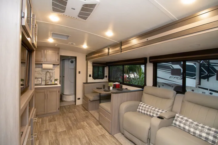 Explore this modern rv rental: full kitchen, comfy dinette, and a spacious living area with reclining seats and shower.. Crossroads RV Sunset Trail Super Lite 2022