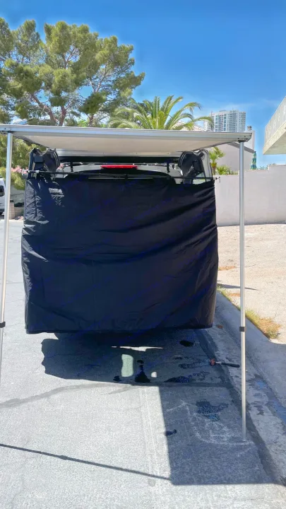 An rv rental showing a rear privacy shower/changing tent and overhead awning for outdoor convenience.. Ford transit connect 2022