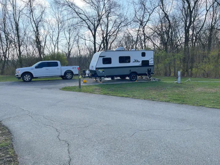 White truck & Jayco travel trailer at an RV campsite. Perfect for your next RV rental adventure!. Jayco Jay Flight SLX STX Edition 2022