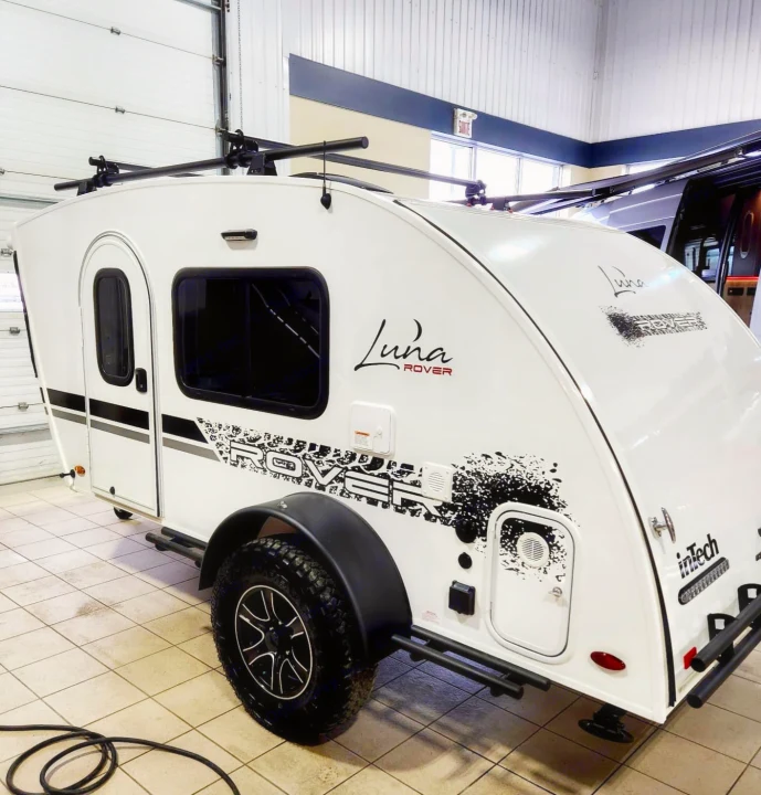 Adventure-ready white Luna Rover teardrop camper. Ideal for your next RV rental, offering rugged travel & camping experiences.. Intech Luna Rover 2023