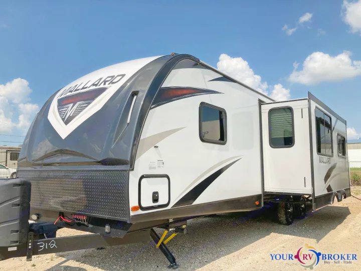 Ready for your next rv rental, this sleek white & black Mallard travel trailer features a convenient slide-out.. Heartland RVs Mallard 2019