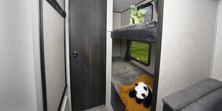 Cozy RV rental bunk beds with a scenic view, perfect for family adventures.. Jayco Jay Flight 2023