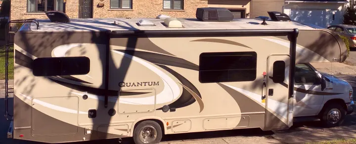 RV rental: Get ready for adventure in this beige Thor Quantum Class C RV, parked outdoors.. Thor Quantum 2018