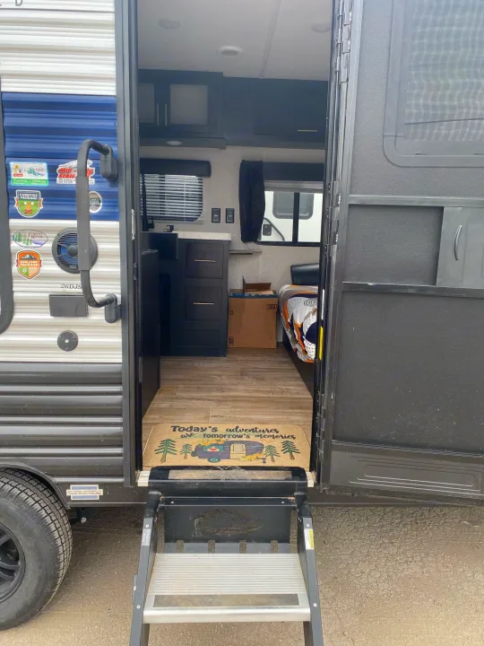 Step into adventure! This RV rental offers a welcoming interior and convenient steps, perfect for your next camping trip.. Forest River Cherokee Grey Wolf Special Edition 2022