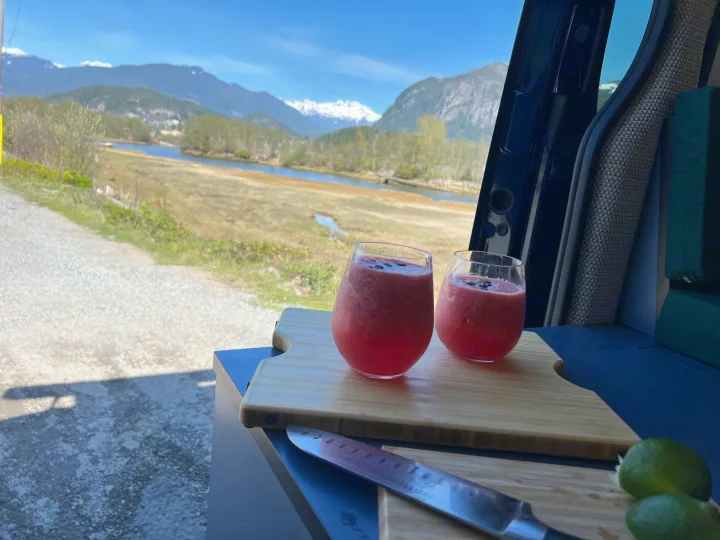 RV rental: Enjoying fresh red drinks, knife & limes on a board, overlooking mountains, a river, and marshland.. Mercedes Sprinter 2022