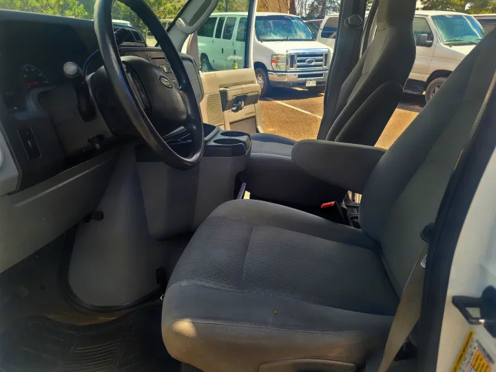 Interior of a white Ford E-Series van, highlighting the driver's area. Great for an rv rental or utility use.. Ford Ford E350 2009