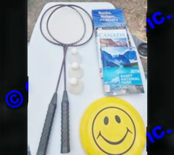 RV rental vacation fun: Badminton set, frisbee, and travel guides like "Canada" for national park adventures.. Chevrolet Open Road 2000
