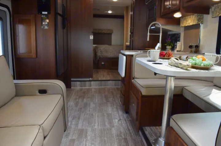 RV rental interior: A bright, well-appointed space with kitchen, dining area, and bedroom for your journey.. Forester Forester Motorhome 2020