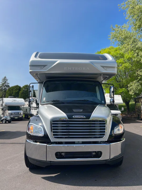 Front view of a striking silver and black Entegra rv rental motorhome on a Freightliner chassis, ready for luxury travel.. Entegra Coach Accolade XL 37L  Super-C 2023