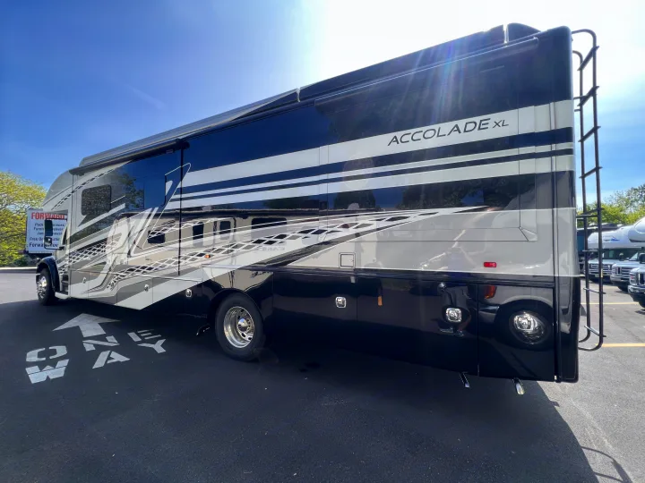 Sleek Accolade XL luxury motorhome with black & white design, hinting at an RV rental adventure.. Entegra Coach Accolade XL 37L  Super-C 2023