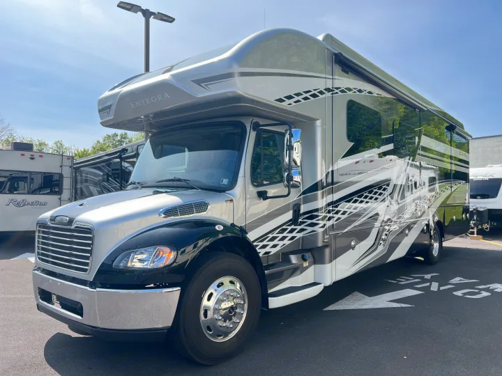 Front-left view of a large, silver and black Entegra Accolade motorhome, ideal for RV rental.. Entegra Coach Accolade XL 37L  Super-C 2023