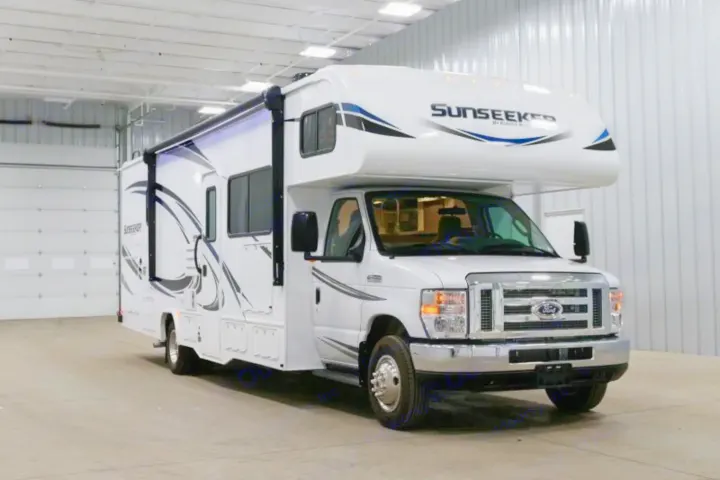 White Class C Sunseeker RV rental, built on a Ford chassis, offers spacious travel for your next adventure.. Forest River Sunseeker 2021