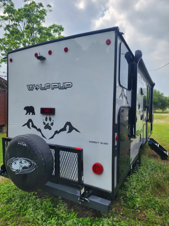 This white Forest River Wolf Pup travel trailer, an excellent RV rental option, is ready for your next adventure.. Forest River Cherokee Wolf Pup Black Label 2022