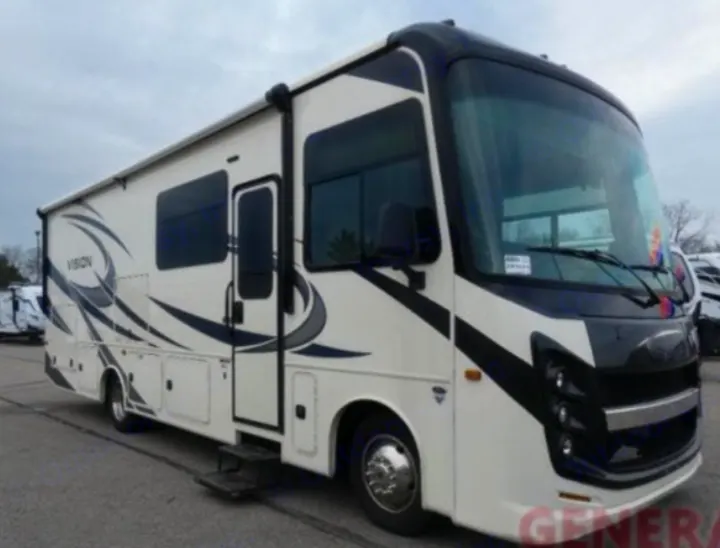 Experience comfort in this white and black Class A motorhome, an ideal rv rental with a large windshield and VISION graphics.. Entegra Coach Vision 2021