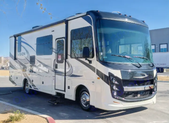 Modern cream & black Class A motorhome, ideal for your next RV rental and travel adventure.. Entegra Coach Vision 2021