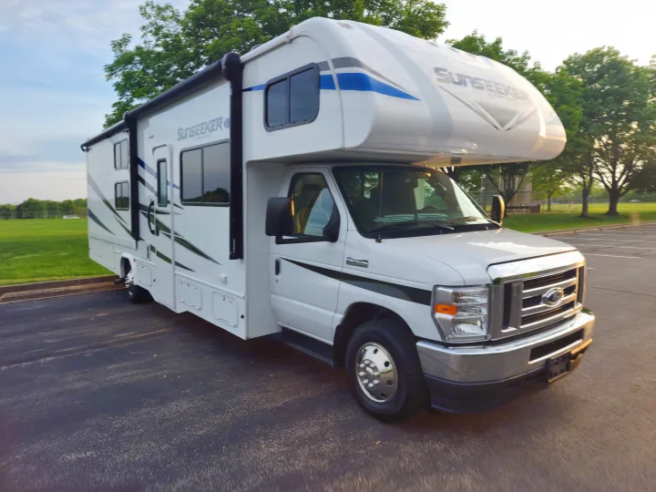White Sunseeker RV rental parked outdoors, ready for your next adventure.. Forest River Sunseeker LE 2021