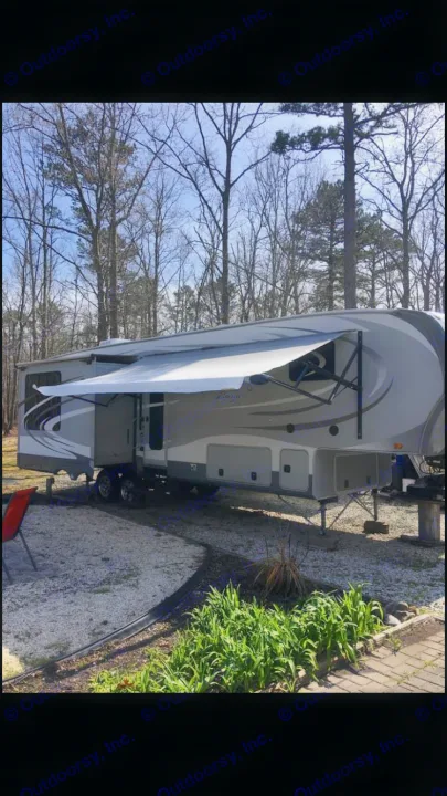 This spacious fifth-wheel RV rental is perfectly set up with its awning extended for your outdoor getaway.. Open Range RV Open Range RV Fifth Wheel 2013