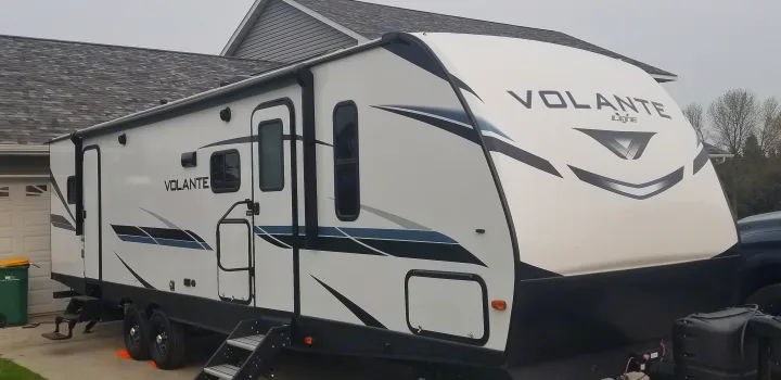 Experience camping with this Volante Lite travel trailer, perfect for an RV rental. Its sleek design promises road trip adventures.. Crossroads RV Volante 2022