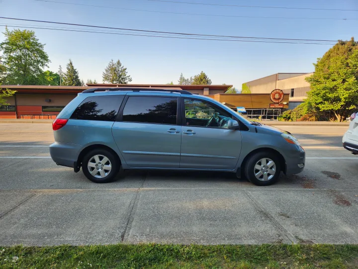 Blue minivan at Comox Community Centre. Ideal for families, see our vehicle & RV rental options.. Toyota Sienna 2008
