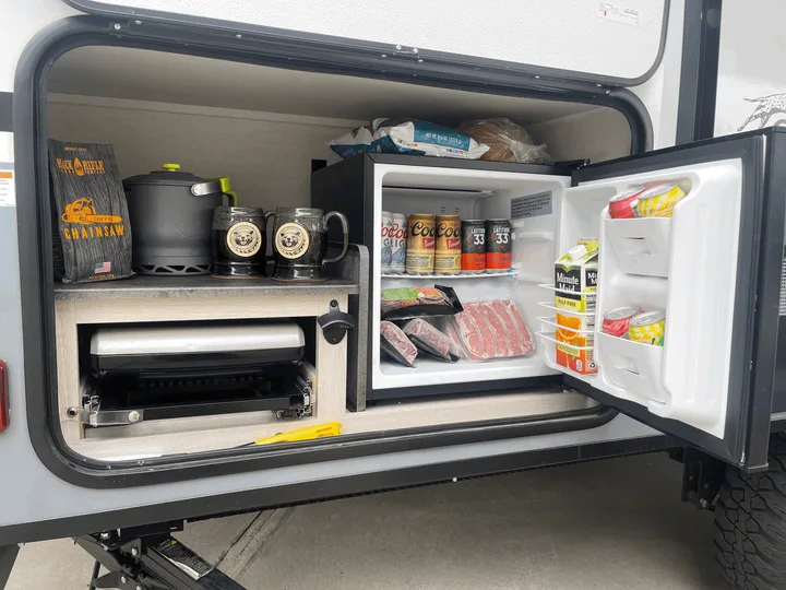 Outdoor fridge with storage (cooktop has been removed). I have a 2 burner camp chef cooktop that is an optional add on. Coachmen Apex Nano 2021