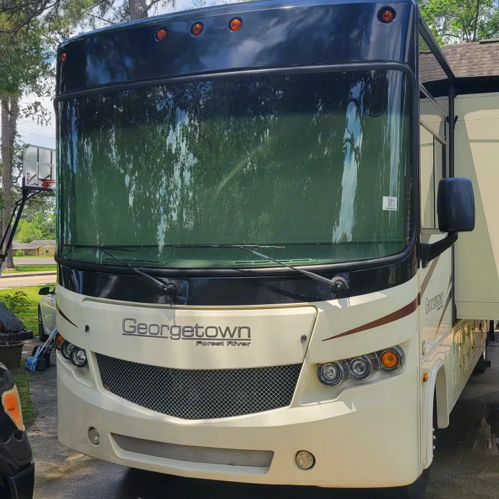 Front view of a cream-colored Georgetown Forest River motorhome, ready for RV rental adventures.. Georgetown GT5 2017