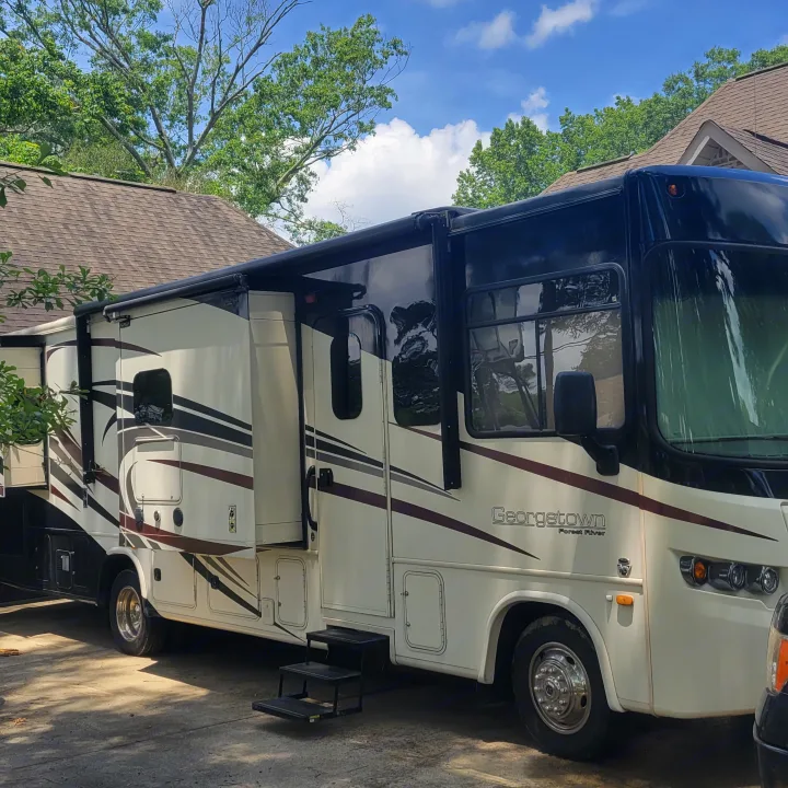 Large Georgetown motorhome RV rental parked outdoors with awning deployed.. Georgetown GT5 2017